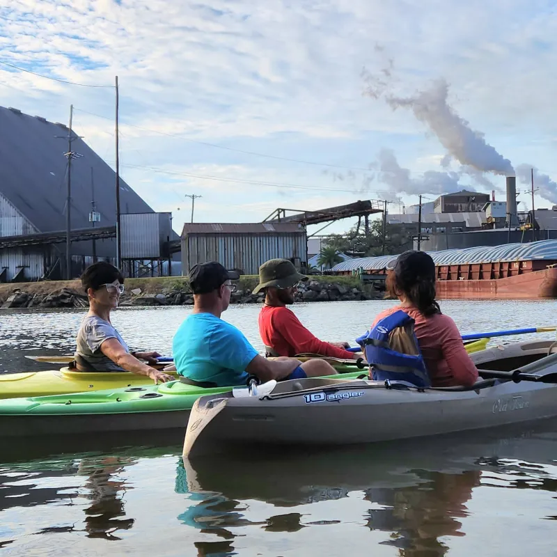 a person riding on the back of a boat in the water